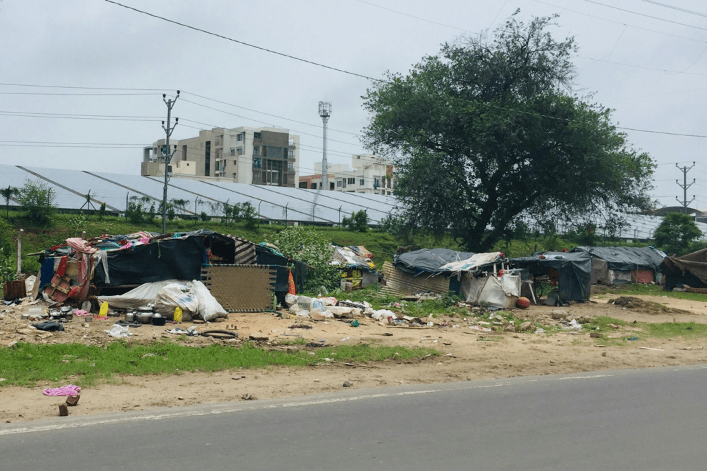 Photo of homeless camp next to road