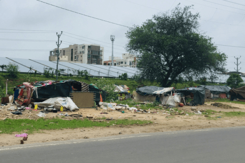 Photo of homeless camp next to road