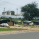 Photo of homeless camp next to road