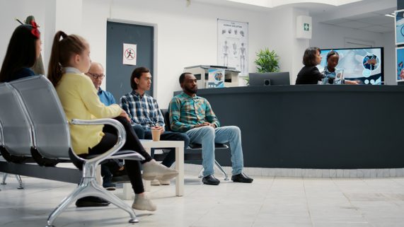 Photo of men and women in waiting room