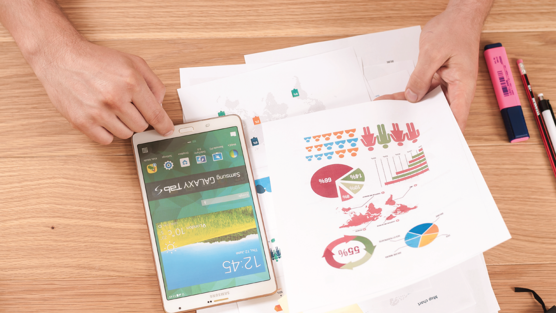 Photo of person with printed business charts