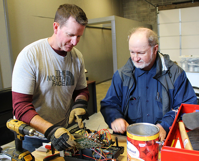 Worth-Shop Photo of men volunteering at Watered Gardens Worth Shop