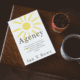 Book "Agency" by Ian V. Rowe sitting on table with coffee and plant