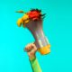 Photo of megaphone with flowers coming out of it
