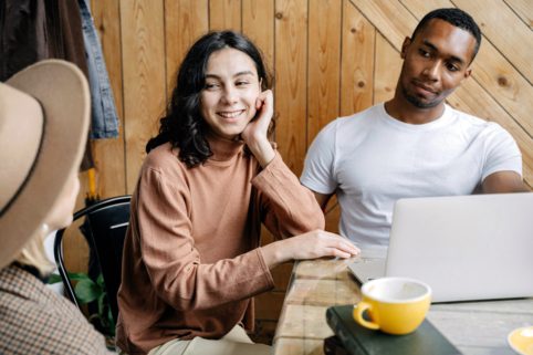 Photo of young people having conversation