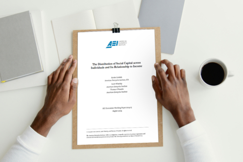 Closeup photo of person's hands holding study from American Enterprise Institute