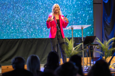 Photo of Megan Rose, CEO of Better Together, speaking at the True Charity Summit