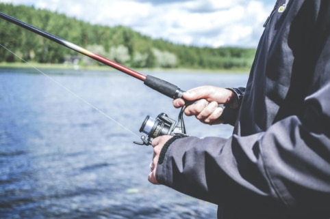 Closeup of man fishing on lake