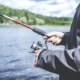 Closeup of man fishing on lake