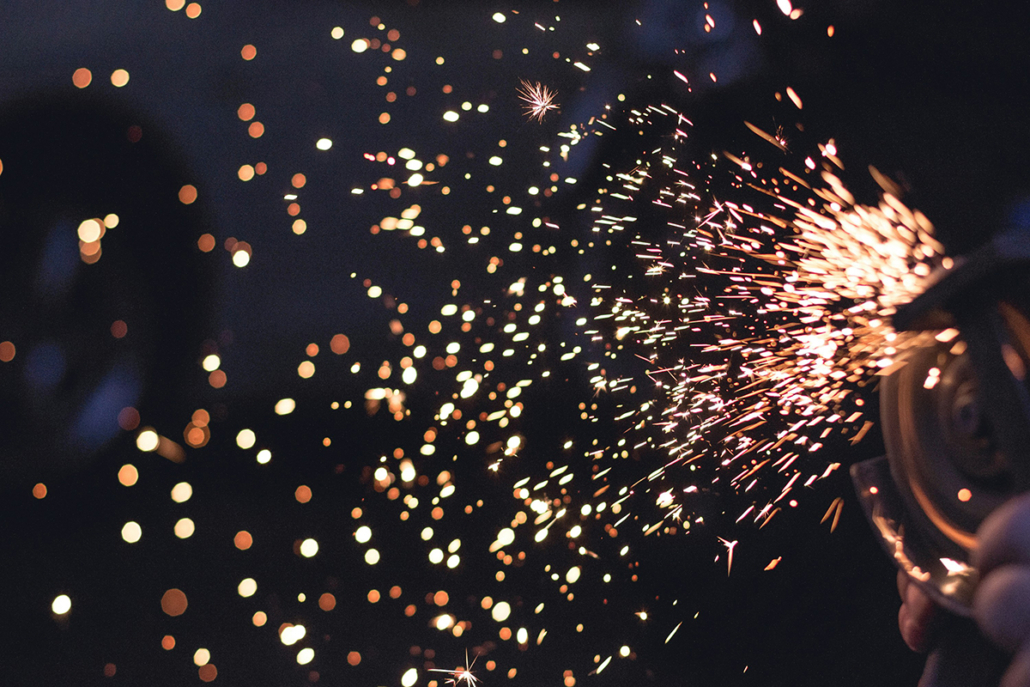 Photo of sparks flying from construction tools