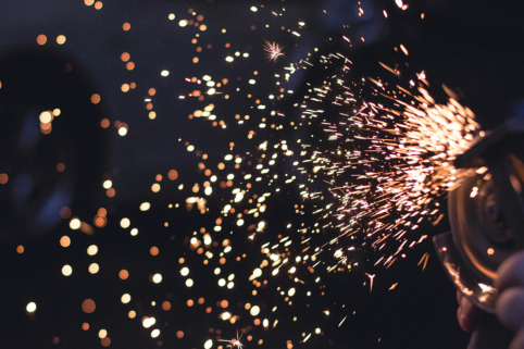 Photo of sparks flying from construction tools