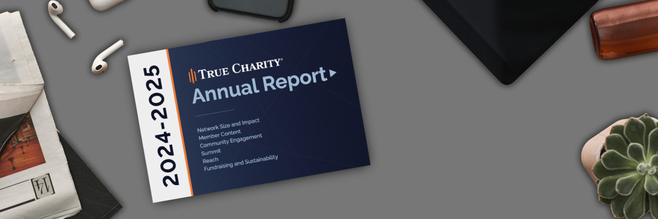 Graphic of True Charity Annual Report on office desk