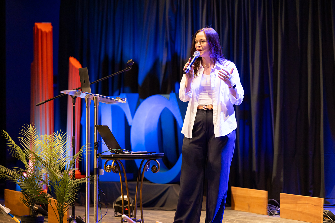 Photo of Bethany Herron speaking at True Charity event