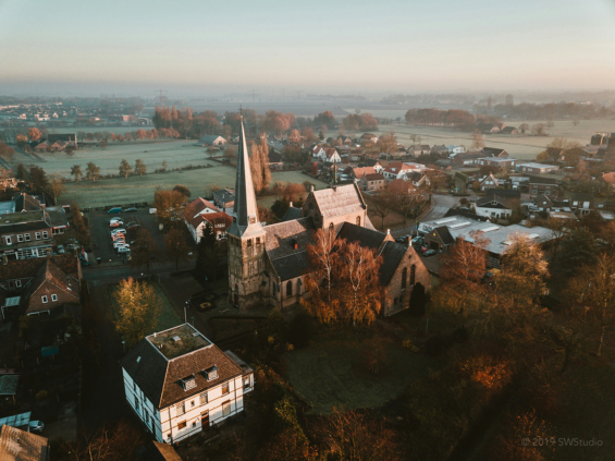 Aerial photo of church in the midst of a town