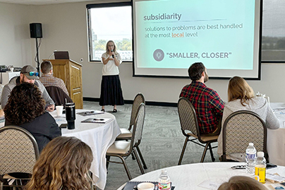 Amanda at workshop Photo of Amanda Fisher presenting at True Charity Community Workshop