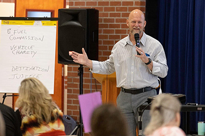 James Whitford at workshop Photo of James Whitford speaking at local event for True Charity